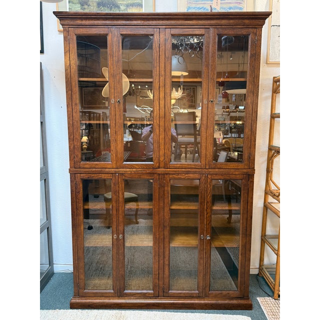 Design Plus Gallery presents a Display Cabinet from Crate & Barrel. The two-piece cabinet is made with a combination of...