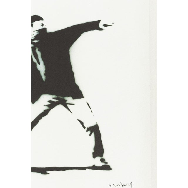 Silkscreen - Banksy (1974) - 'The Famous Flower Thrower'. The Famous Flower Thrower. Silkscreen on paper, numbered 39/150....