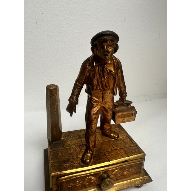 Antique 19th century Continental Gilt bronze "Bootblack" figure with his shoebox in hand. He is standing on a "brick"...