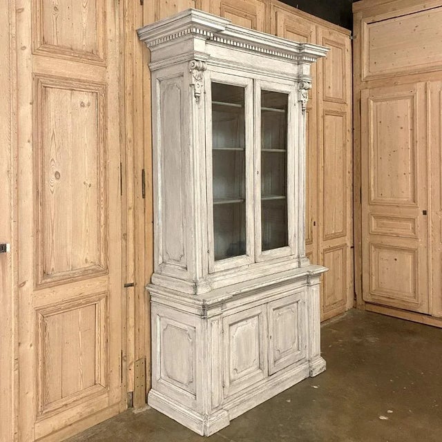 18th Century Italian Neoclassical Painted Bookcase is a marvel of architecture inspired by the masters of ancient Greece...