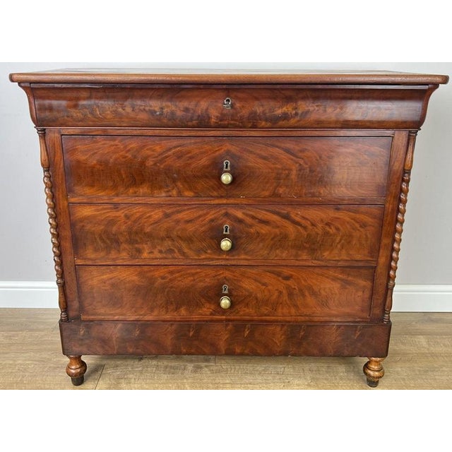 This elegant Antique French Burr chest of drawers is a striking period piece, showcasing the rich and distinctive grain of...