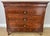 This elegant Antique French Burr chest of drawers is a striking period piece, showcasing the rich and distinctive grain of...