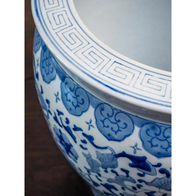 Elegant flower pot made of high-quality porcelain, hand-painted with underglaze painting in classic cobalt blue. The...