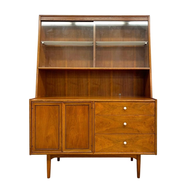 This vintage Mid Century Modern china cabinet hutch is part of the iconic Declaration line designed by Kipp Stewart for...