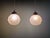 Pair of Art Deco pendant lights in molded, pressed frosted glass with chromed metal brackets, 1920s-30s. Each light has...
