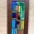 For your consideration, a vertical wooden wall art piece featuring a colorful geometric enamel on copper inlay. A dark...