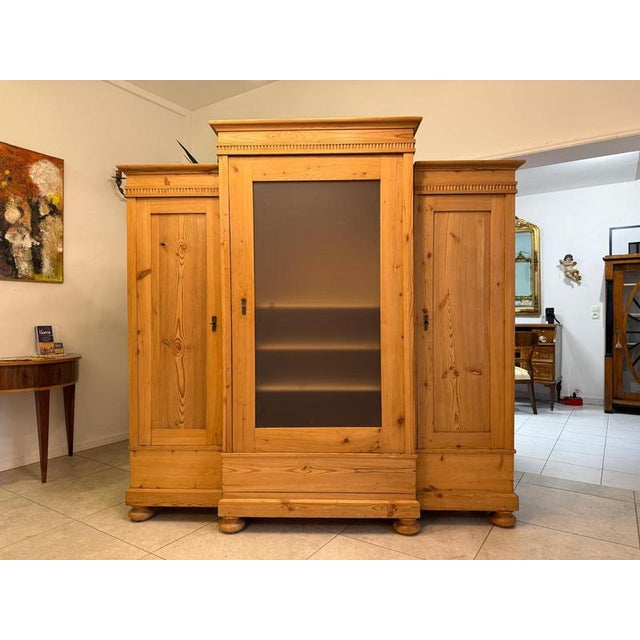 Spacious Gründerzeit wardrobe, circa 1875. Dimensions: Height x Width x Depth 196 x 200 x 60 cm. For sale is a three-part...