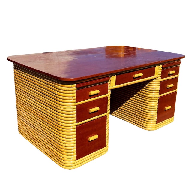 This beautifully restored Paul Frankl style 61" wide stacked rattan desk blends style and vintage charm with modern...