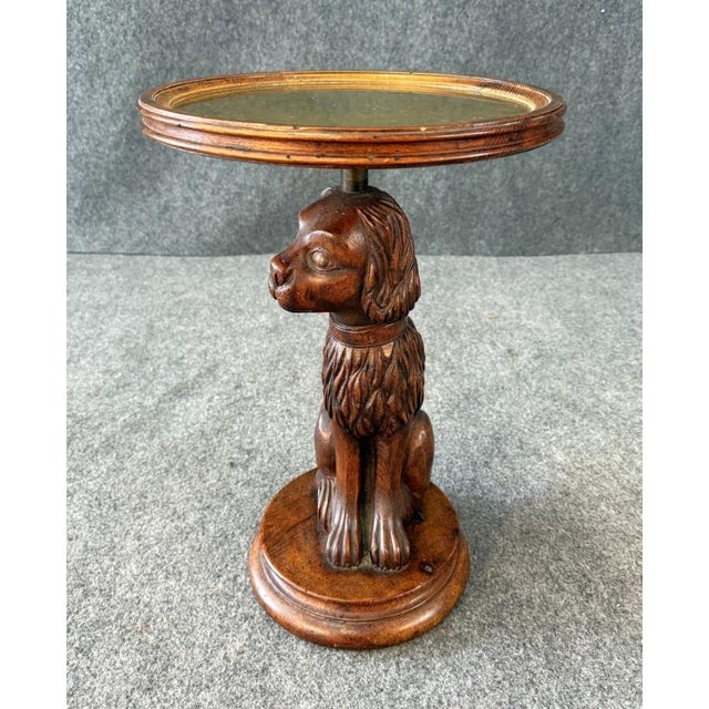 This Hand-Carved Dog Pedestal Side Table with Brass Top showcases remarkable craftsmanship, featuring a finely detailed...