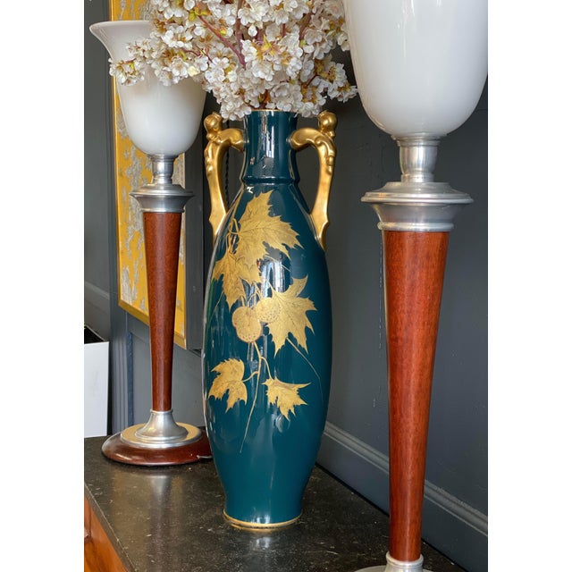 Most Gustave Asch Porcelain vase works come in cobalt blue. This piece is a rare blue green. It was created in the village...