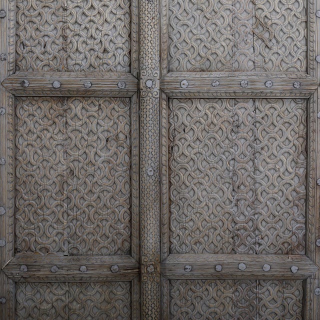Antique Indian carved teakwood door, c. 1880–1900, carefully bleached to highlight its sculptural interlocking weave...