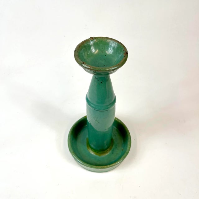 This oil lamp is a nice piece but has undergone some repairs. You’ll notice it might have broken at the stem and reattached.