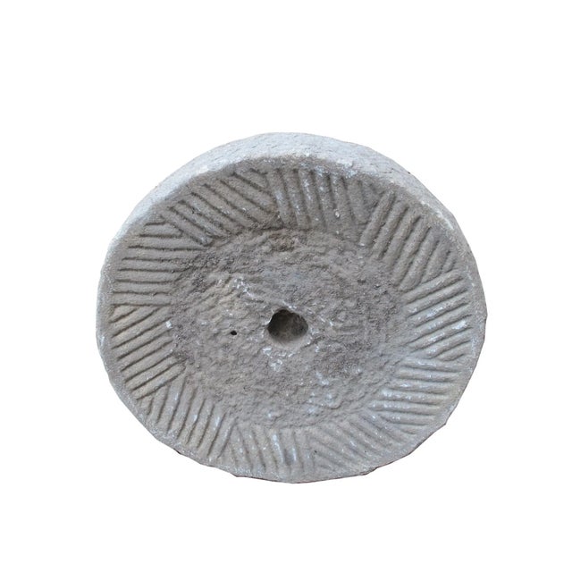 This bottom of a watermill stone was retrieved from the northern part of China. It was originally used for grinding...