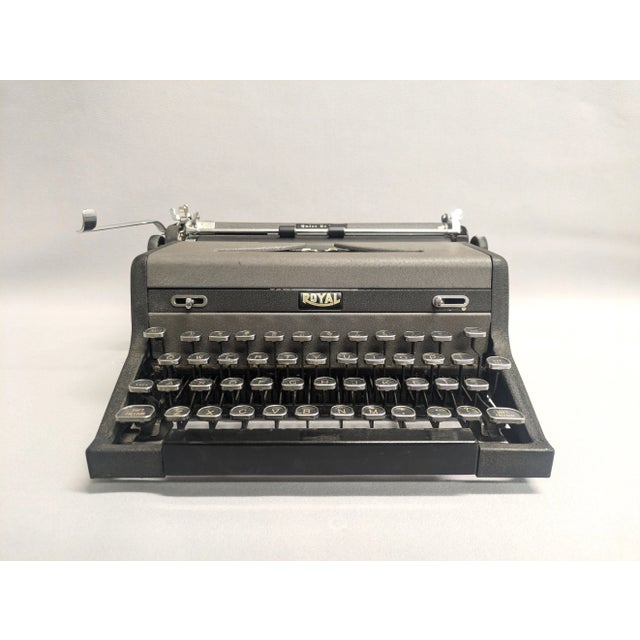 This 1948 mid-century Royal typewriter was the last year it was made. The Quiet DeLuxe portable gray and black typewriter...