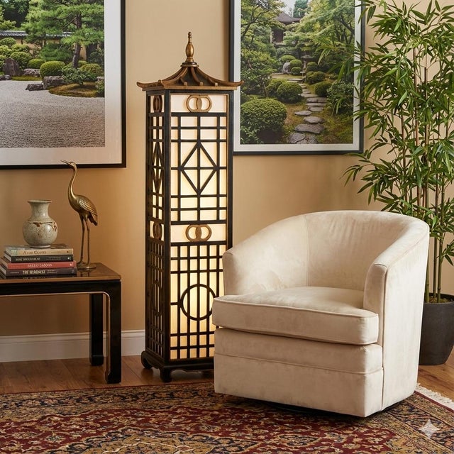 This is a fun 1980s chinoiserie floor lamp. It is in working order. The gilded top is removable for bulb changing. It is...