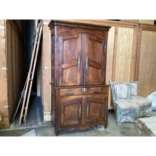 French 19th century 2-tier cupboard. A true antique, this piece is made of cherry wood and has been polished for over a...