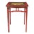 Tibetan red lacquered hard wood table with hump-back apron rails joining four turned legs. The painted table top features...