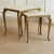 A pair of nesting tables in brass with white marble tops, made around 1950–1960 in the style of Louis XV. The curved lines...