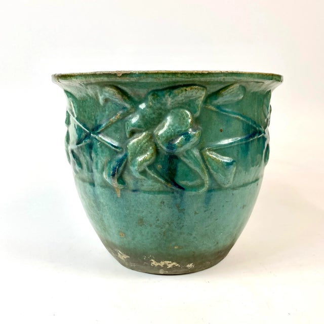 This blue green morning glory planter would make a beautiful addition to your home or garden.