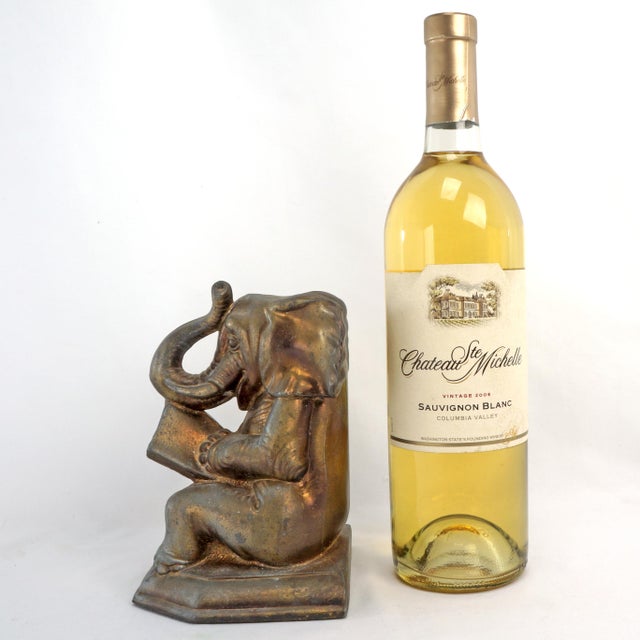 An amusing bookend in the shape of an elephant reading a book. He is even a lucky elephant with his trunk up. The bookend...