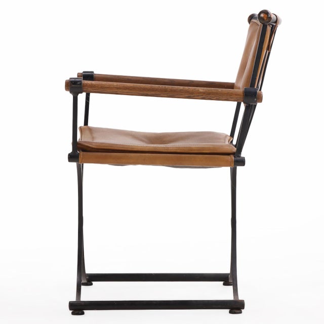 Set of four iron-framed dining chairs in the style of Cleo Baldon, featuring a sculptural cerule-form base with...