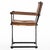 Set of four iron-framed dining chairs in the style of Cleo Baldon, featuring a sculptural cerule-form base with...