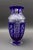 Bohemian Czech Cobalt Blue Cut To Clear Crystal Vase With Sawtooth Rim. Measures approximately 6" diameter, 12 1/2" high.