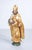 Group of three gilded wooden sculptures: saint francis of assisi, saint gratus of aosta with the head of john the baptist,...