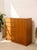 A handsome Danish modern cabinet dresser with a warm wood finish and a clean, architectural silhouette. The asymmetrical...