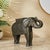 Dimensions: 11" W x 28" D x 22" H This vintage elephant sculpture is hand carved in solid wood and is fully cladded with...