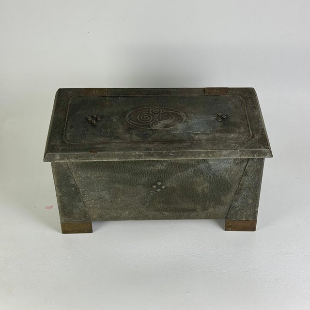 A beautiful Arts & Crafts era metal box with copper elements. A non-locking lid complete the structure of this storage...