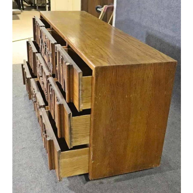 Mid-century modern long dresser designed by Lane Furniture for their Pueblo collection. Featuring a mosaic wood collage...