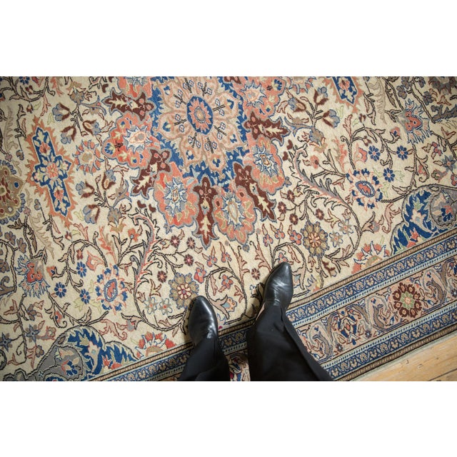 :: Starburst center medallion surrounded by spiraled tendrils and vines scrolling the main field wrapped by a floral...