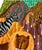 A delightfully rendered modernist folk art painting of a lively jungle scene complete with all manner of exotic animals....