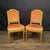 A beautifully matched pair of antique French Louis XVI side chairs from the Napoleon III Belle Epoque era. Crafted with...