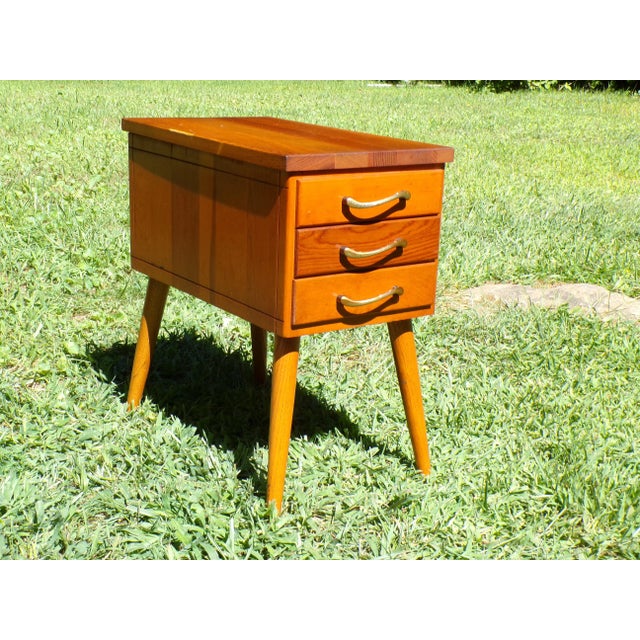 Vintage Mid Century Sewing Stand End Table Nightstand features 2 drawers and a hinged top with retro pulls, and stands on...
