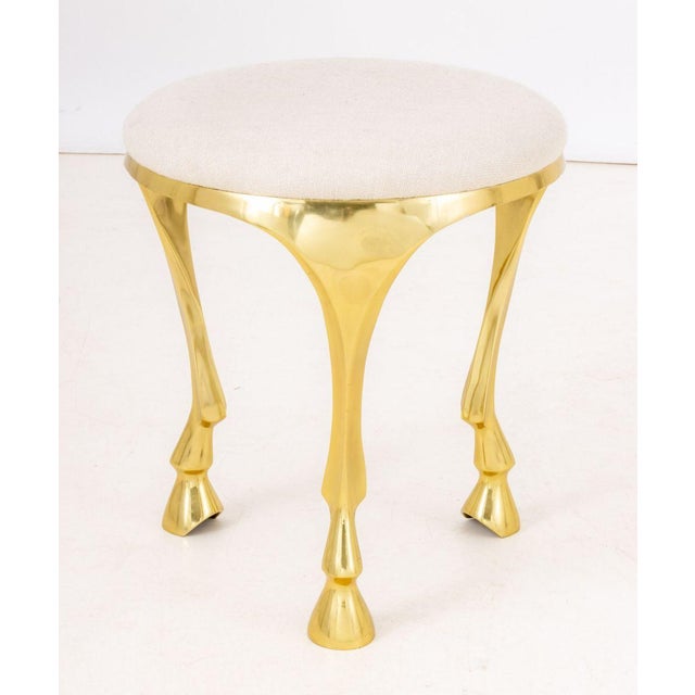 Postmodern Hoof Foot Upholstered Tripod Stool, on three gilt legs, CB2 label to underside. 18.5" H x 16" Diameter....