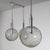 A pair of pendant lamps designed by Tobia Scarpa for Flos in 1964. The globe-shaped bodies are crafted from frosted glass,...
