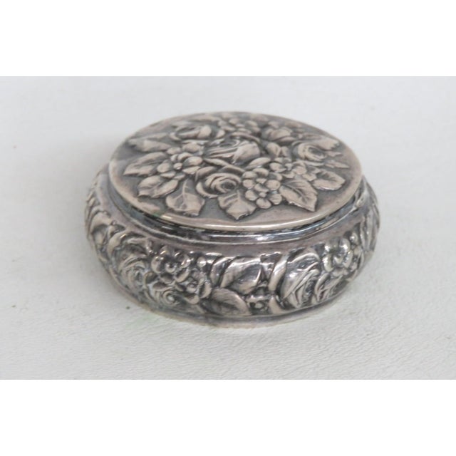 This lovely Lidded Pill Box is made of sterling silver. This stunning compact container features a highly detailed...