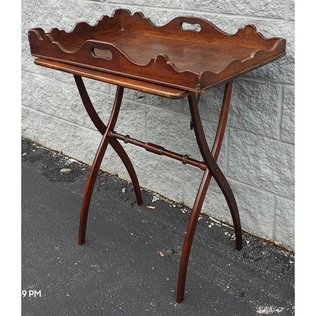A 19th Century George III style Mahogany butler Tray Table. This can may be used as two separate pieces as the base may be...