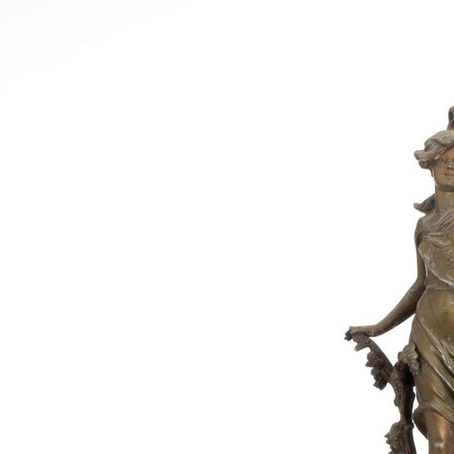 Table clock - La Vigne Par Pathou - 19th century. French; 19th century; art bronze; marble base topped by a female figure....