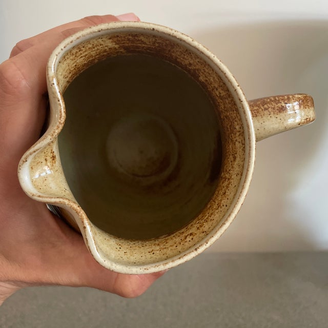 Ceramic Brown and beige Arts and Crafts pitcher. Brown shiny glaze.