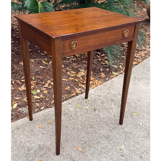Lovely 19th C. one drawer stand with warm hand rubbed antique patina and original brass pulls. Wonderful graceful lines....