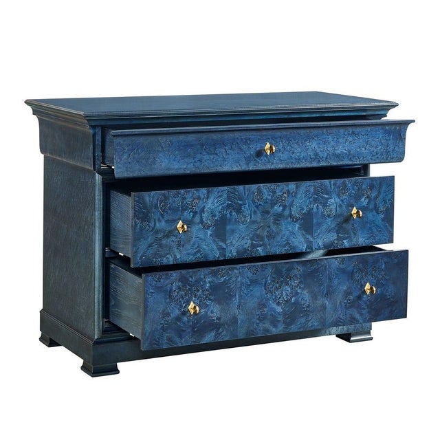 True in form and function this version is entirely clad in exotic burlwood veneer. This chest presents a unique twist with...
