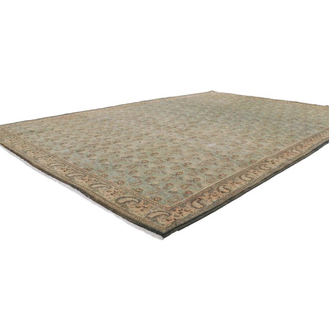 61004 Distressed Vintage Persian Qum Rug, 06'09 x 09'05. Weathered finesse meets ivy league prep in this hand knotted wool...