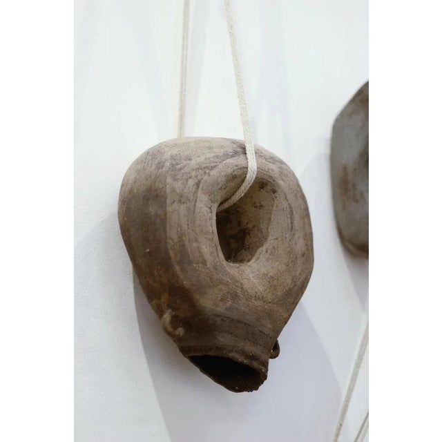 Generation 03 by Eguzkiñe Egaña Unique Dimensions: W 25 x L 10 x H 27 cm Materials: Black stoneware, slip and rope In this...