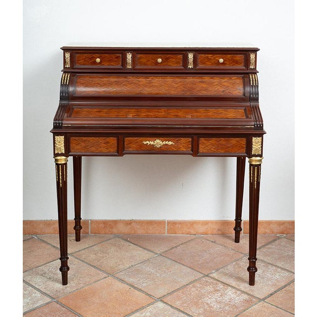 Antique Napoleon III French roller desk in polychrome wood with a Verde Alpi marble top. Opening the lower drawer opens...