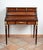 Antique Napoleon III French roller desk in polychrome wood with a Verde Alpi marble top. Opening the lower drawer opens...
