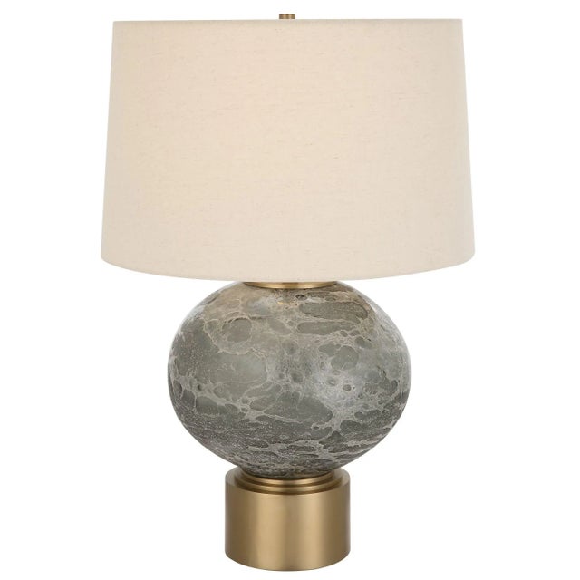 The Lunia Table Lamp Showcases A Beautiful, Smoky Gray Art Glass Center With A Textured Surface, Accented By Antique...