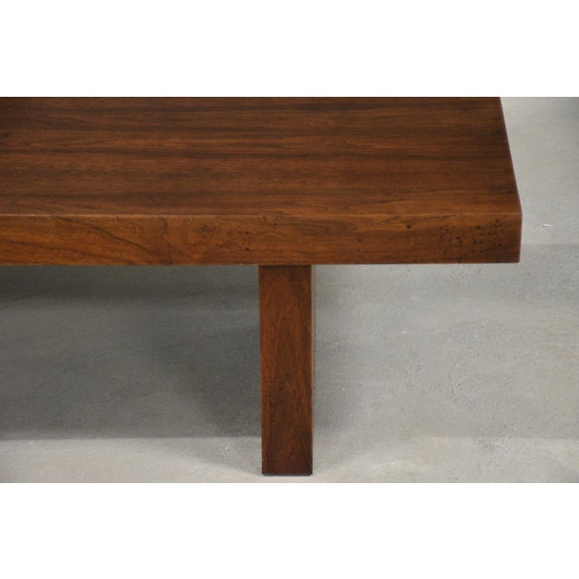 A mid century modern walnut coffee table. Made in USA. Original finish in excellent condition with minor discoloration on...